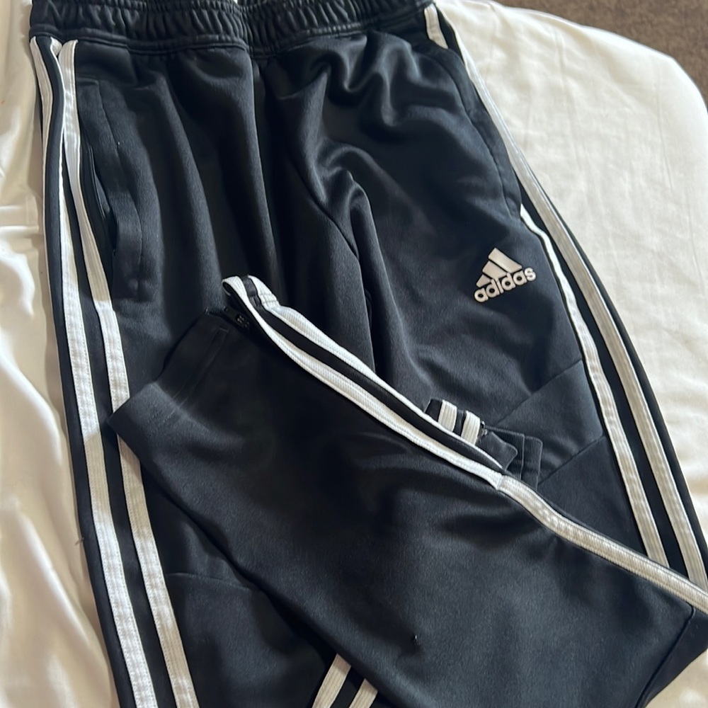 Black with white stripes Adidas joggers.